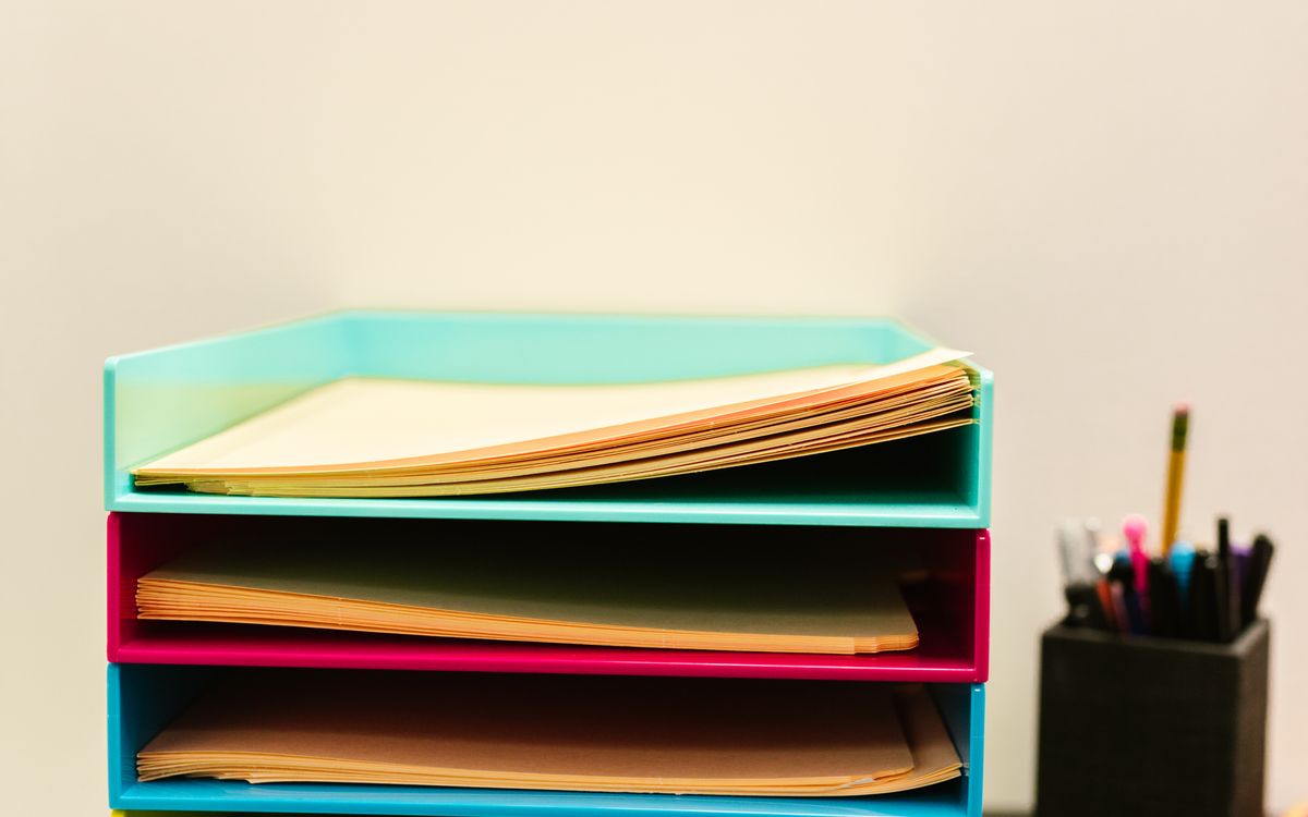 Document trays holding an organized stack of paperwork