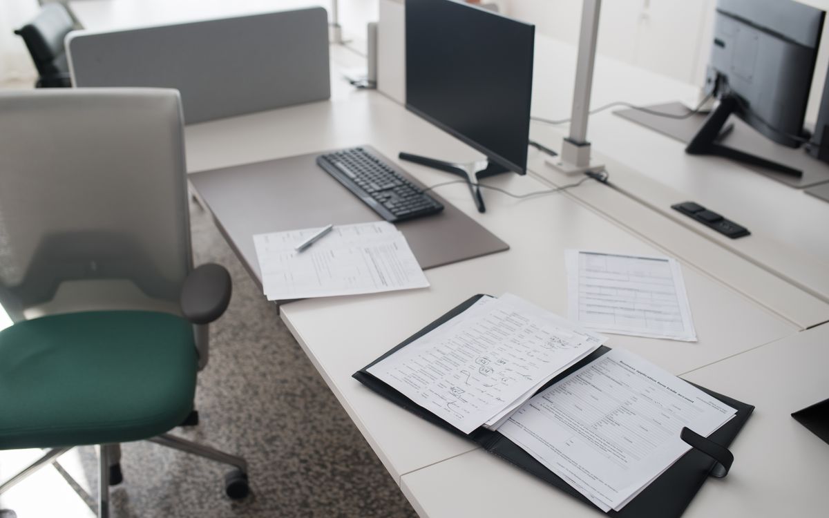 Binder and documents on an office desk