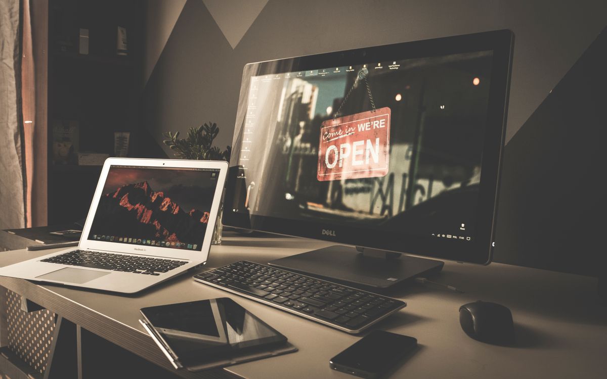 Computer monitor and laptop in a media workspace